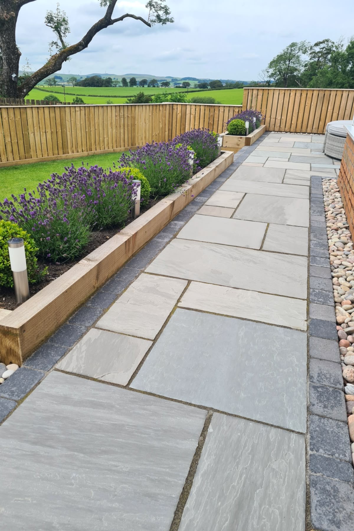Sandstone patio with lavender planting